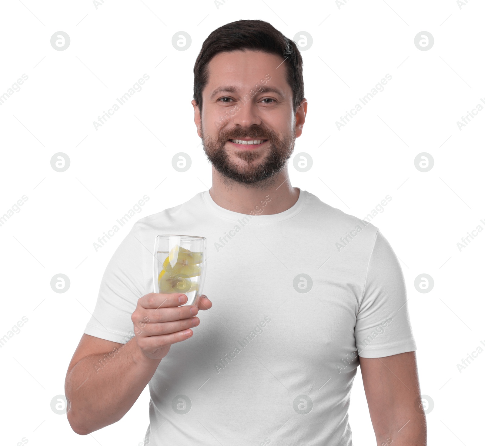 Photo of Happy man holding glass of water with lemon on white background