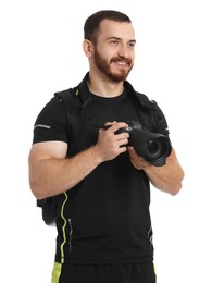 Photographer with backpack and camera on white background