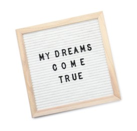 Photo of Letter board with phrase My dreams come true on white background, top view