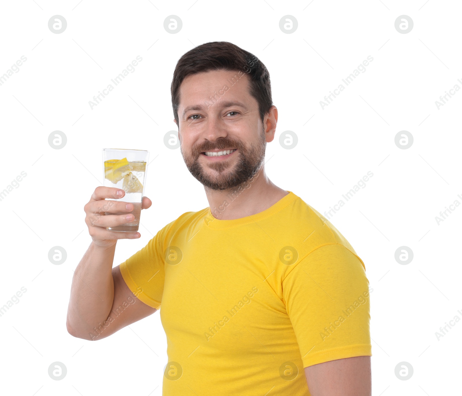 Photo of Happy man holding glass of water with lemon on white background