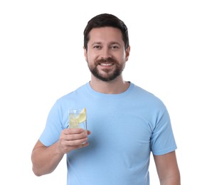 Photo of Happy man holding glass of water with lemon on white background