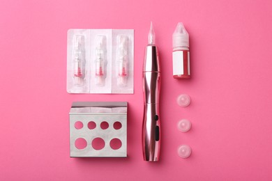 Permanent makeup equipment kit on pink background, flat lay