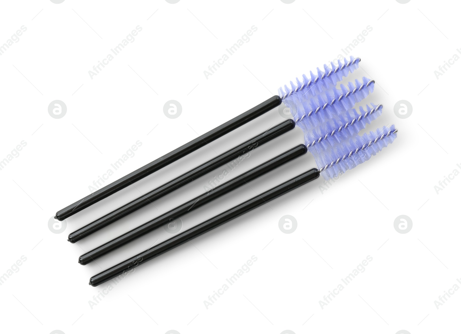 Photo of Disposable makeup brushes isolated on white, top view