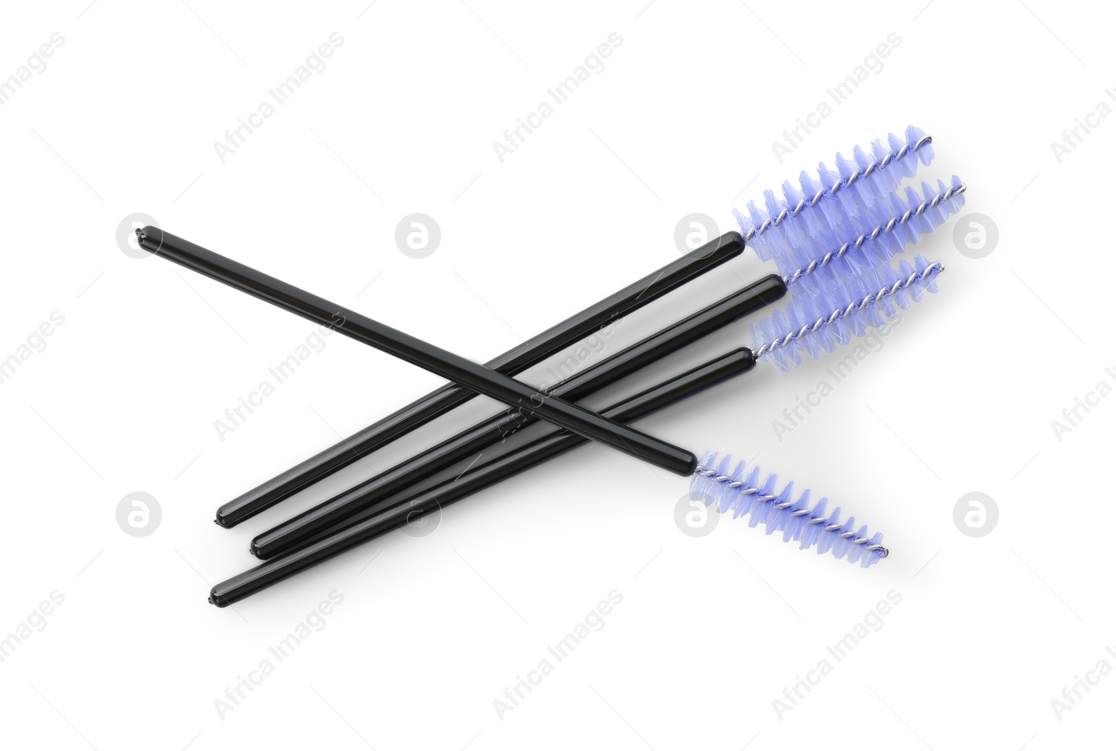 Photo of Disposable makeup brushes isolated on white, top view