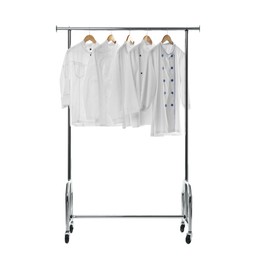 Photo of Different chef's coats on clothing rack against white background