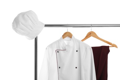 Chef's uniform on clothing rack against white background