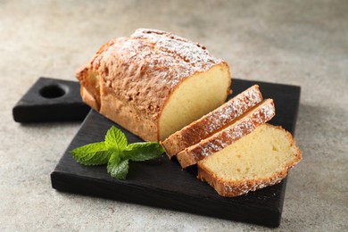 Photo of Freshly baked sponge cake on light grey table