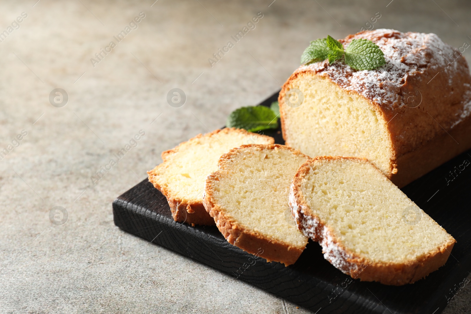 Photo of Freshly baked sponge cake on light grey table