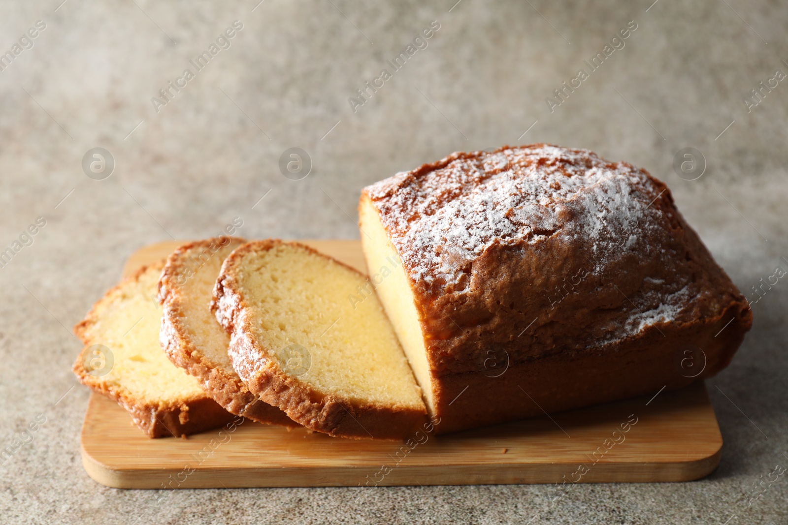 Photo of Freshly baked sponge cake on light grey table