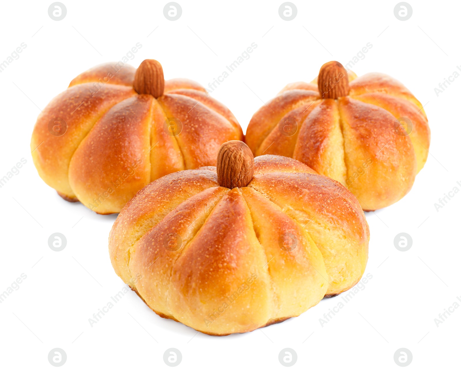 Photo of Tasty pumpkin shaped buns isolated on white