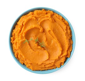 Photo of Tasty mashed sweet potato and thyme in bowl isolated on white, top view