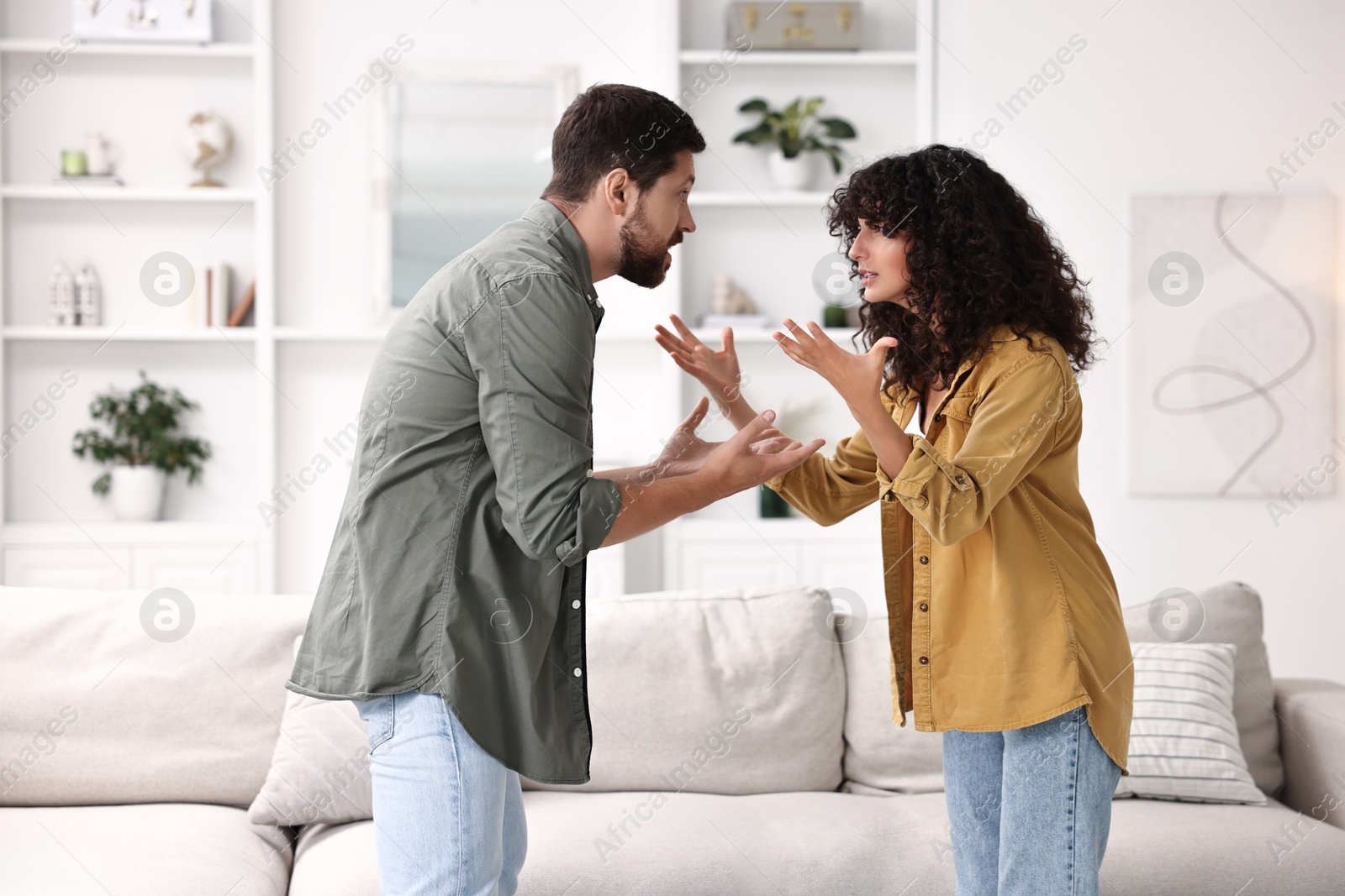 Photo of Emotional couple arguing at home. Relationship problems