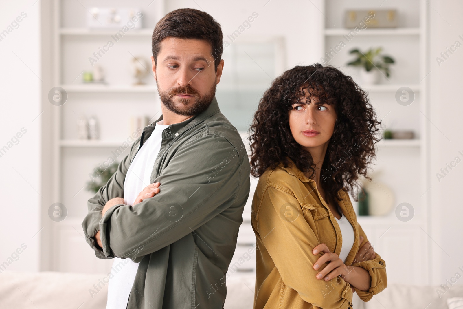 Photo of Emotional couple having quarrel at home. Relationship problems