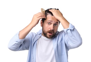 Man brushing his hair on white background. Alopecia problem