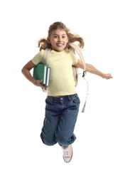 Photo of Girl with backpack and books jumping on white background