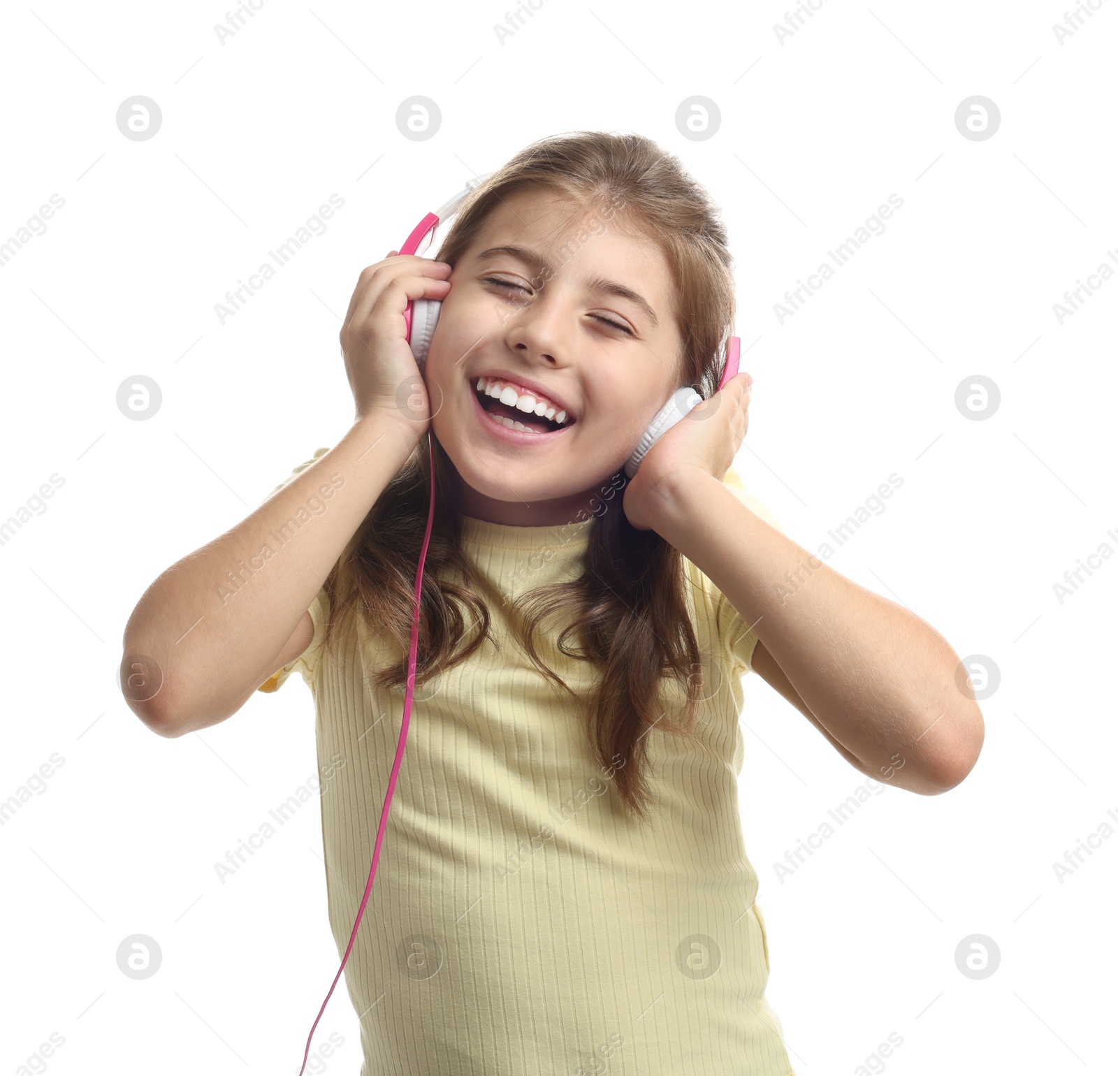 Photo of Portrait of cute girl listening to music on white background