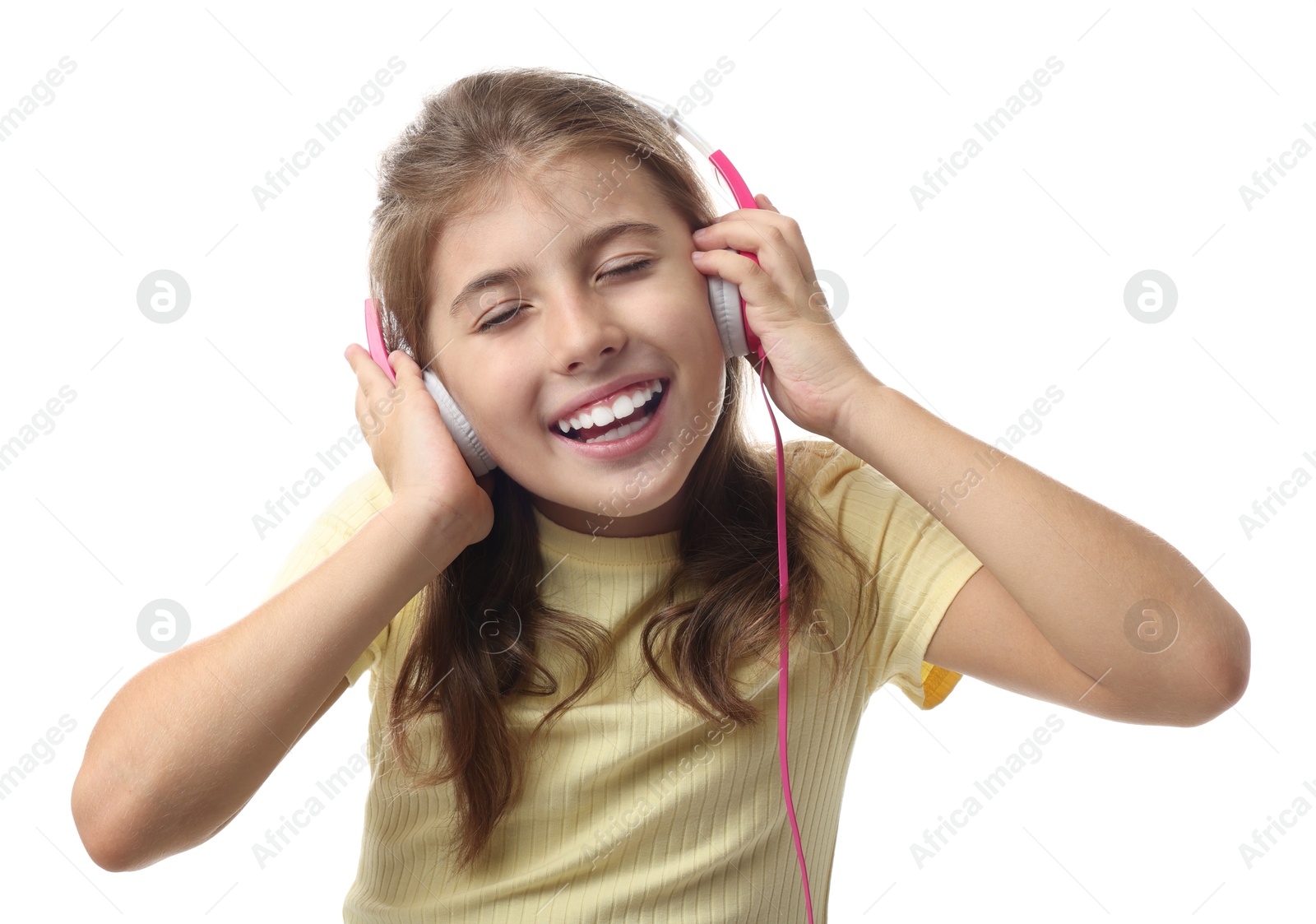 Photo of Portrait of cute girl listening to music on white background