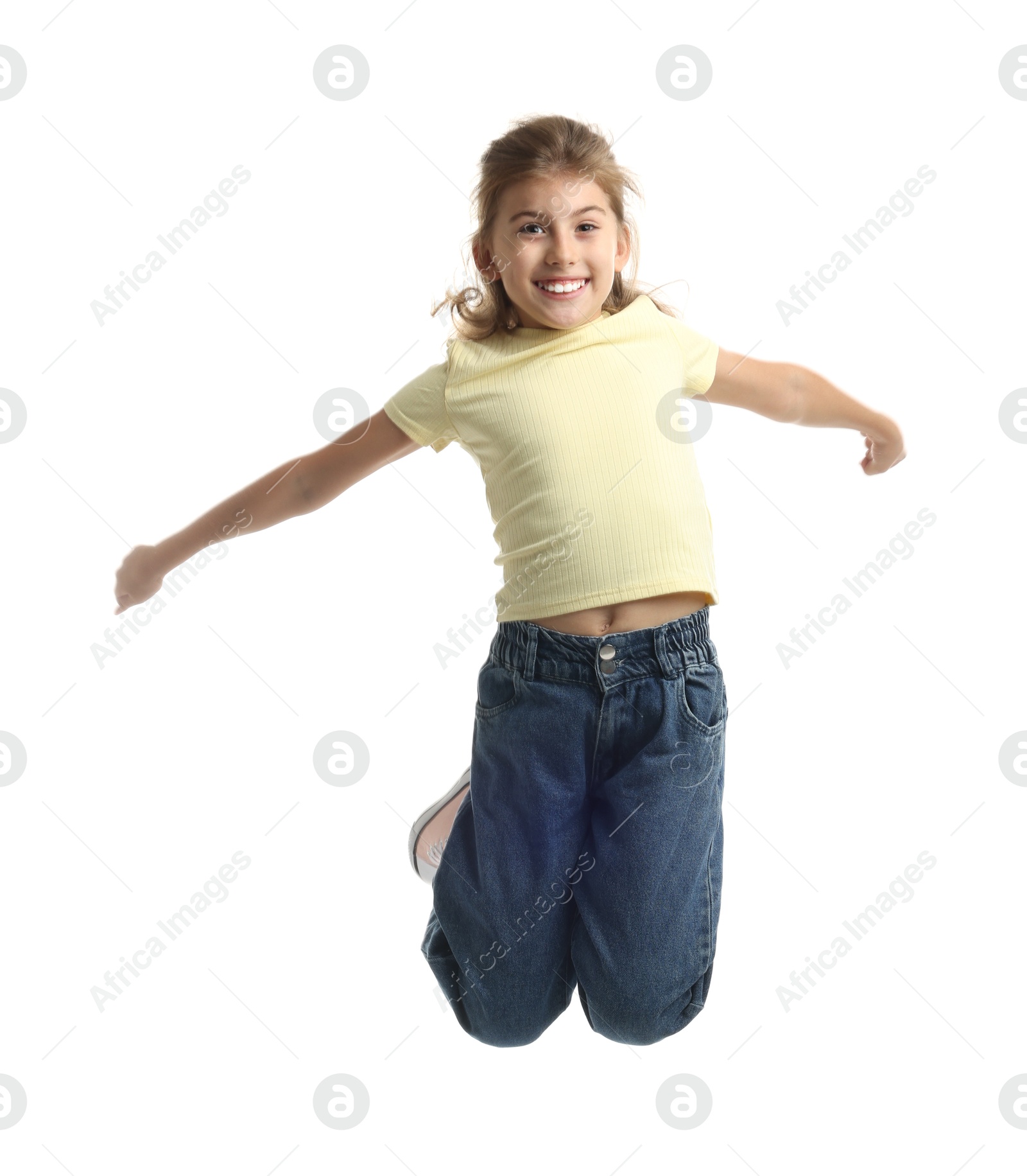 Photo of Cute positive girl jumping on white background