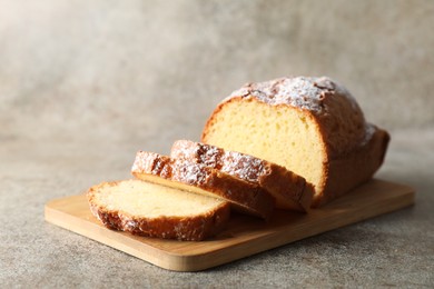 Photo of Freshly baked sponge cake on light grey table