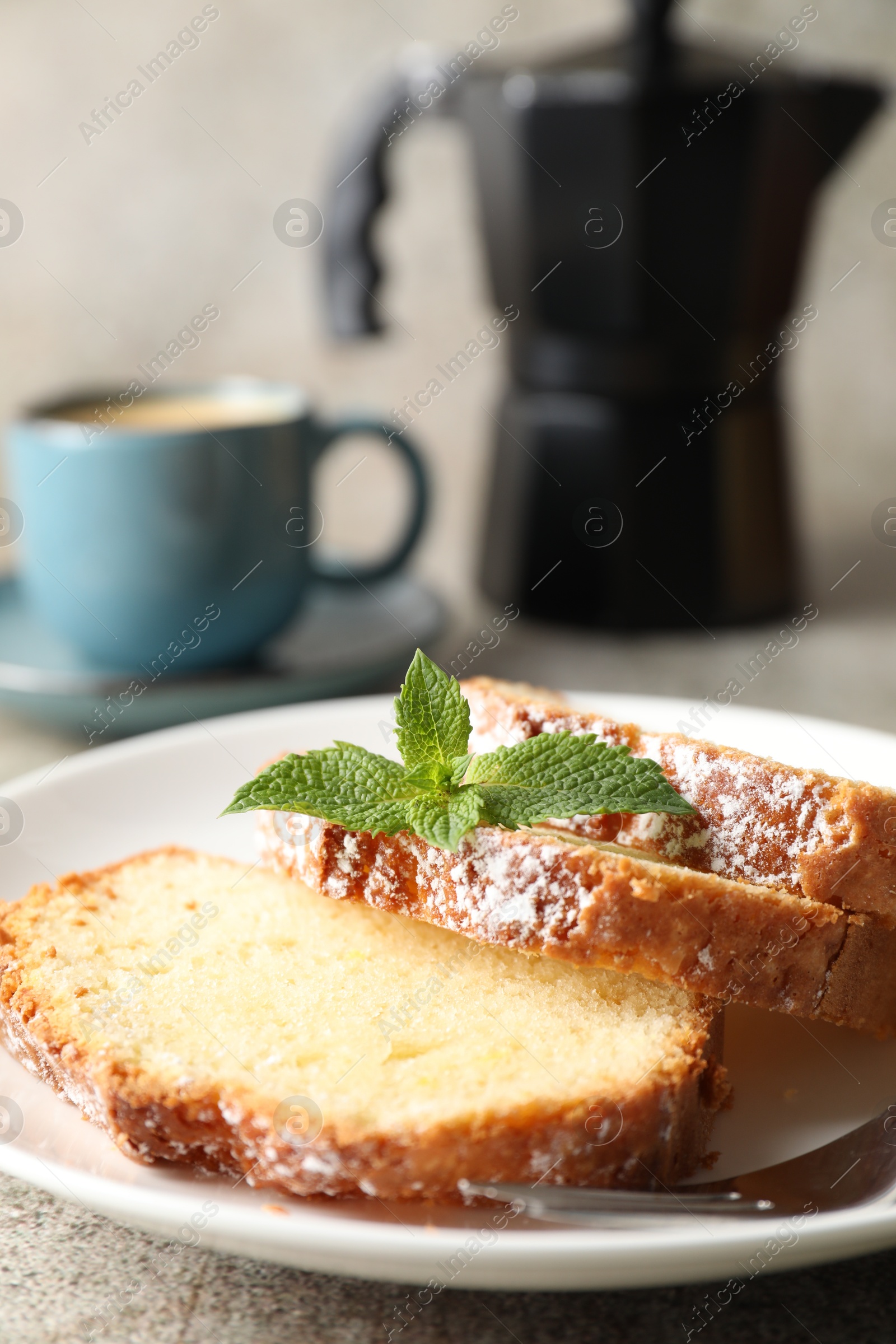 Photo of Freshly baked sponge cake and coffee on light grey table, closeup