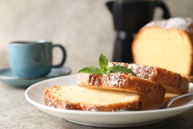 Photo of Freshly baked sponge cake and coffee on light grey table, closeup