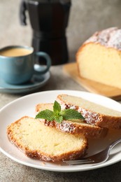 Photo of Freshly baked sponge cake and coffee on light grey table, closeup