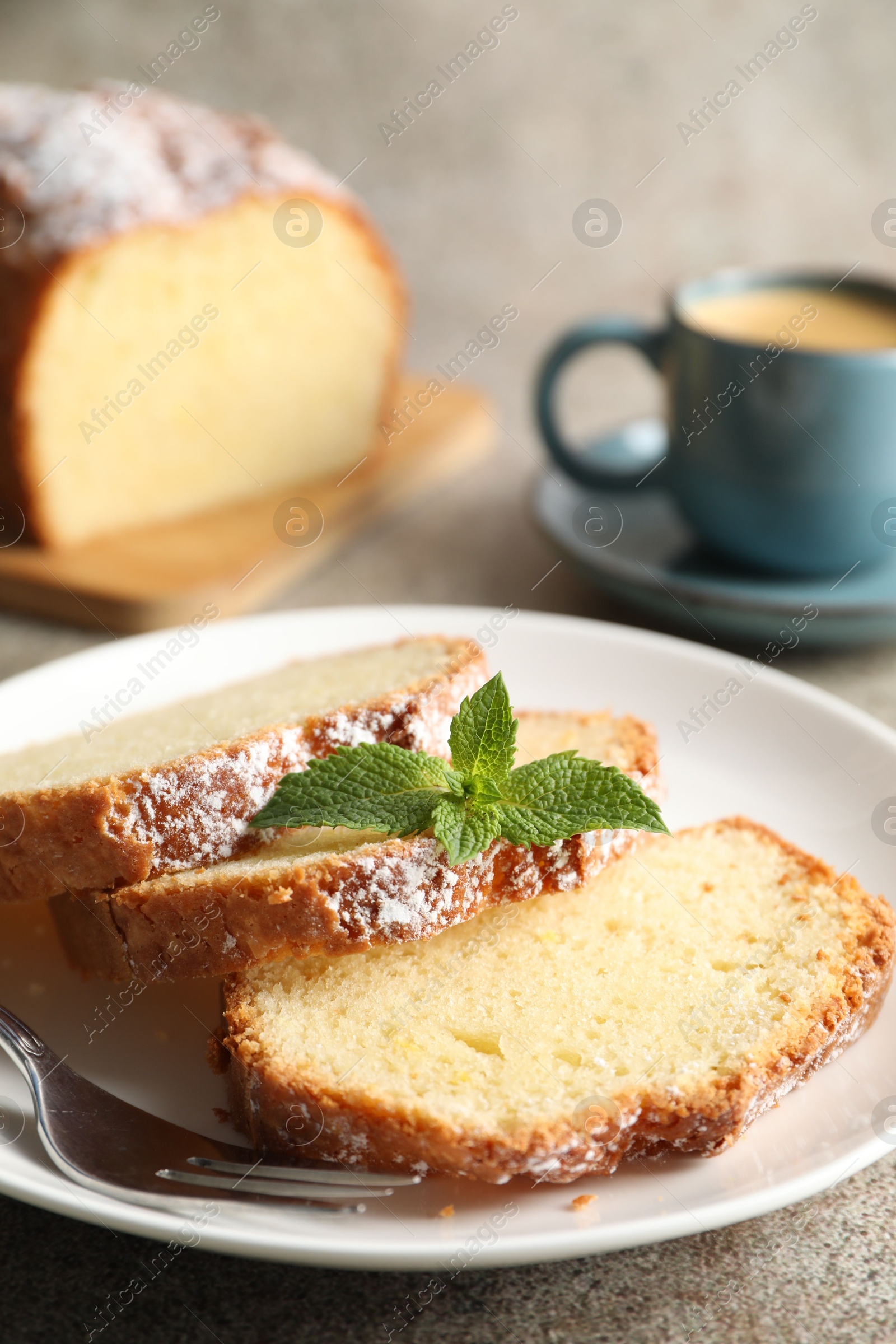 Photo of Freshly baked sponge cake and coffee on light grey table, closeup