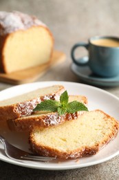 Photo of Freshly baked sponge cake and coffee on light grey table, closeup