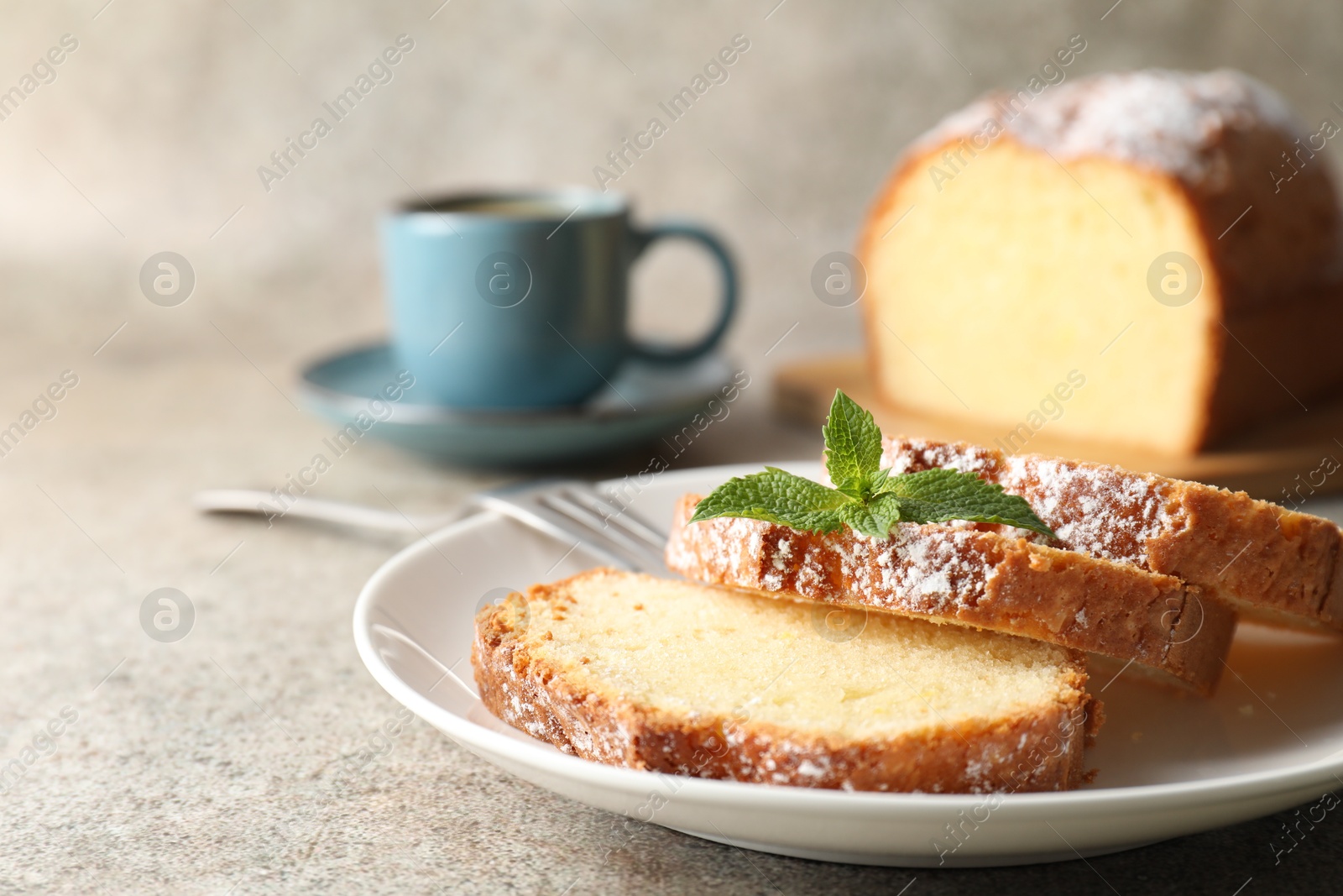 Photo of Freshly baked sponge cake and coffee on light grey table, closeup