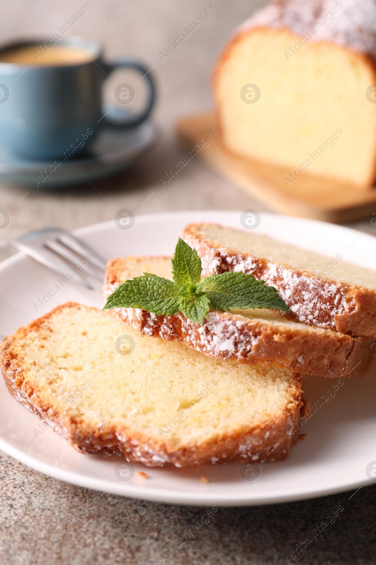 Photo of Freshly baked sponge cake and coffee on light grey table, closeup