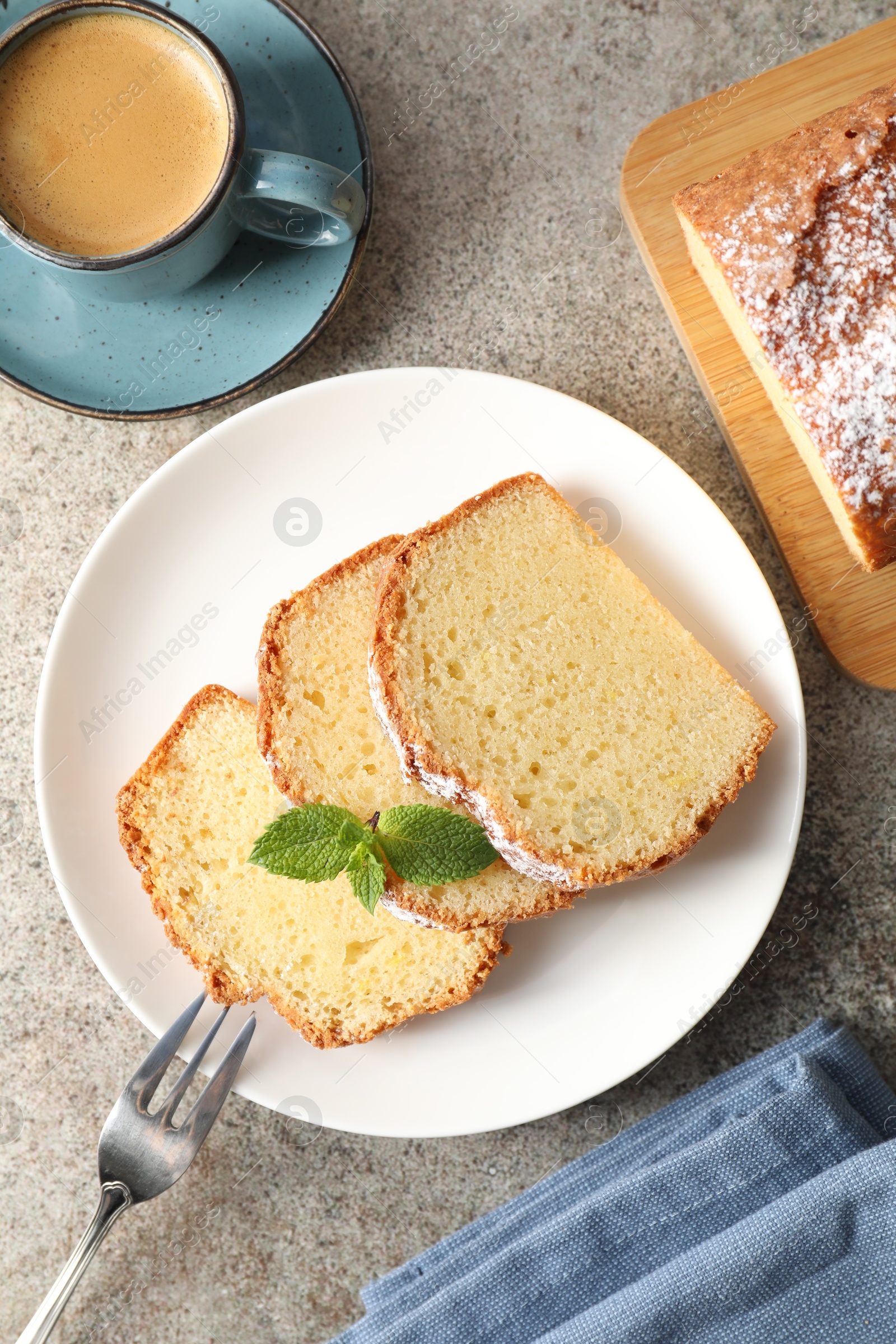 Photo of Freshly baked sponge cake and coffee on light grey table, flat lay