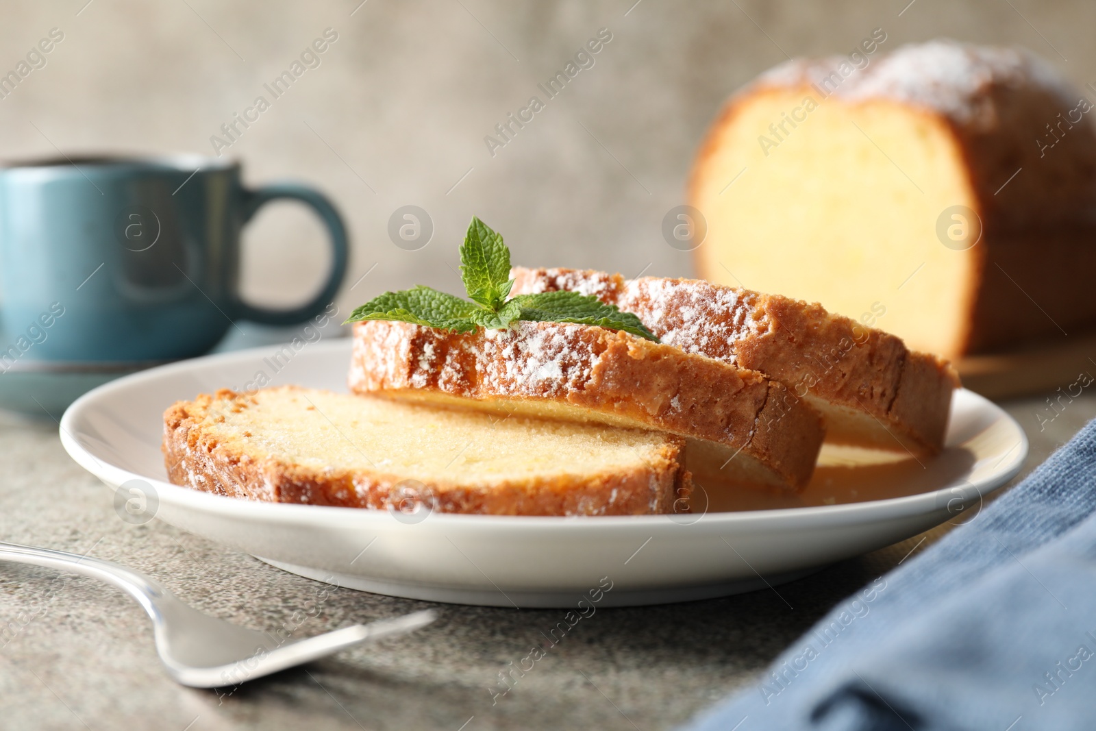 Photo of Freshly baked sponge cake and coffee on light grey table, closeup