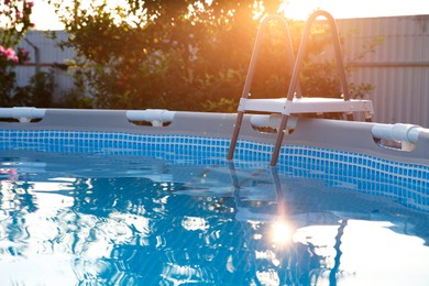 Photo of Above ground swimming pool outdoors on sunny day, closeup