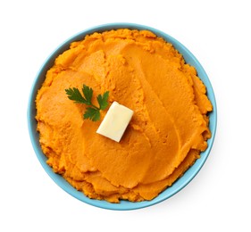 Photo of Tasty mashed sweet potato with butter and parsley in bowl isolated on white, top view