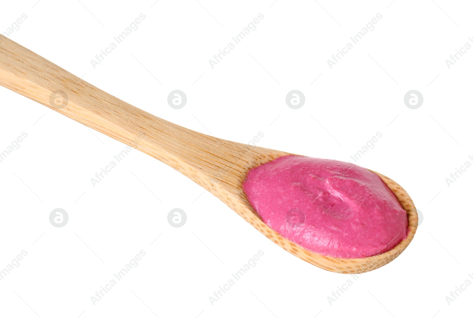 Photo of Tasty beetroot hummus in wooden spoon isolated on white