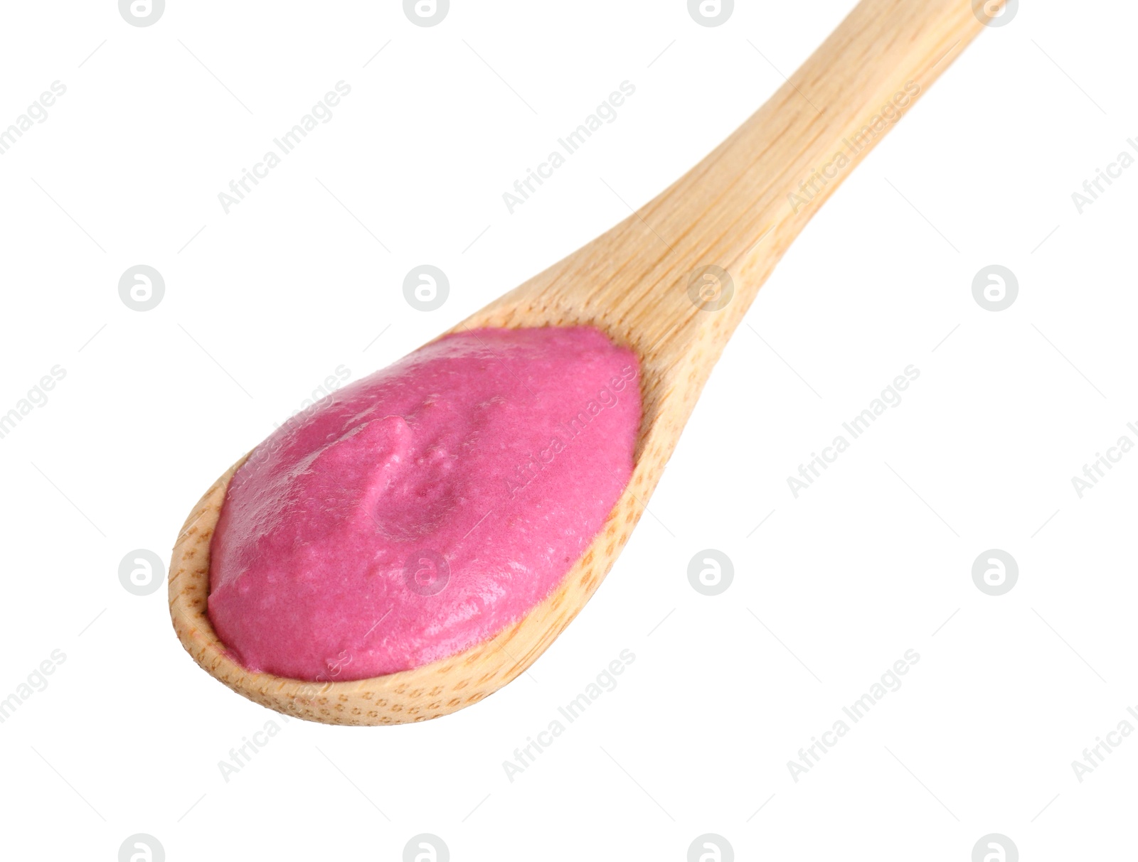 Photo of Tasty beetroot hummus in wooden spoon isolated on white