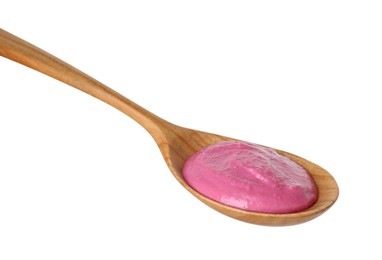 Photo of Tasty beetroot hummus in wooden spoon isolated on white