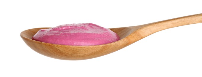 Photo of Tasty beetroot hummus in wooden spoon isolated on white