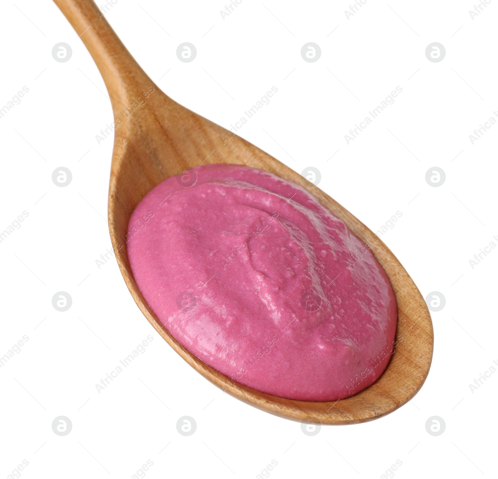 Photo of Tasty beetroot hummus in wooden spoon isolated on white