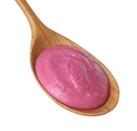 Photo of Tasty beetroot hummus in wooden spoon isolated on white