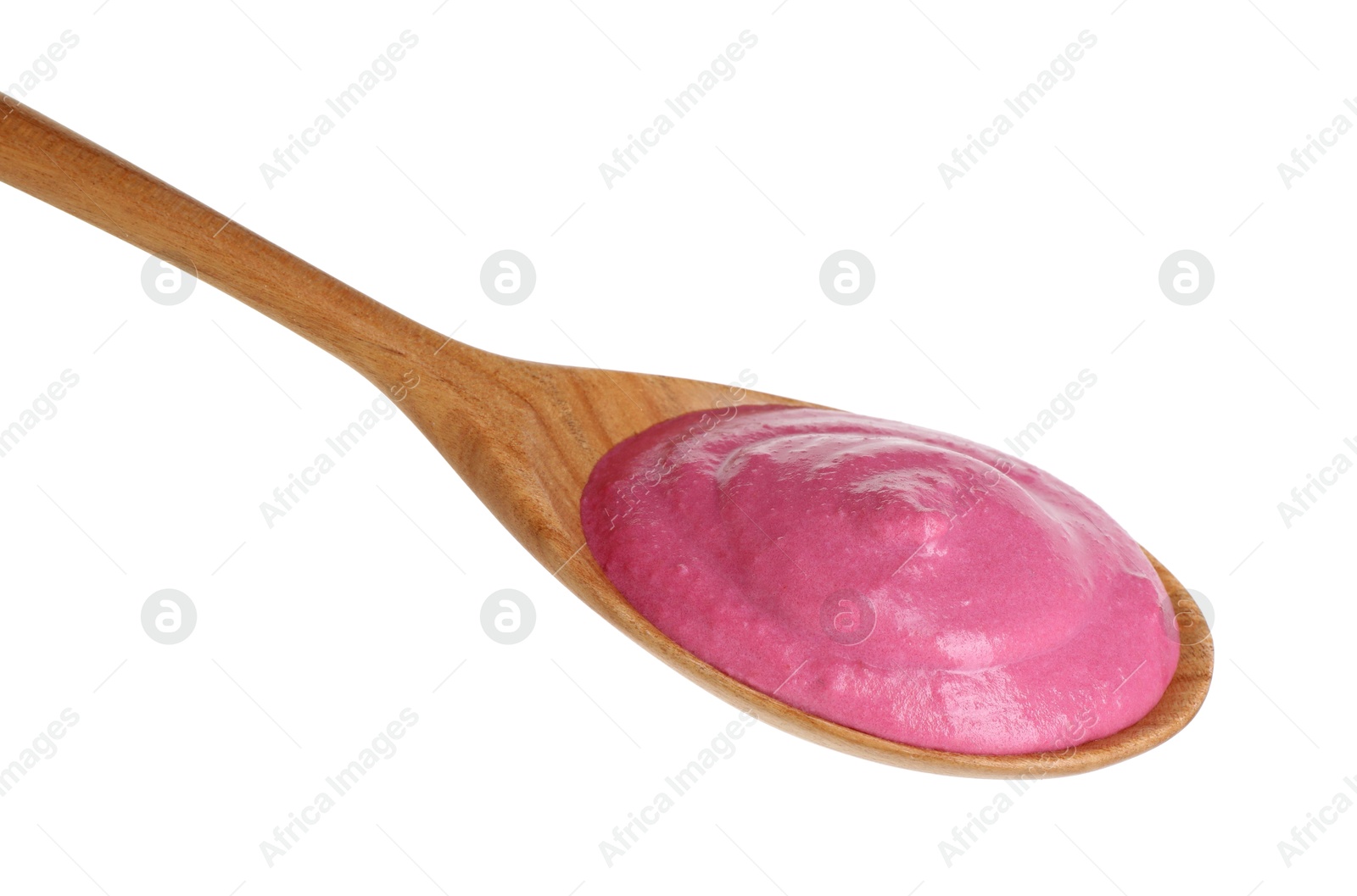 Photo of Tasty beetroot hummus in wooden spoon isolated on white