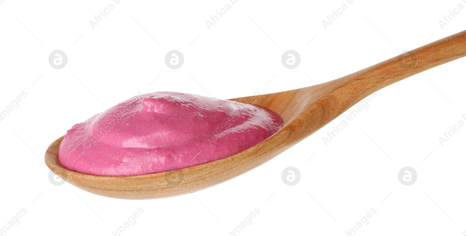 Photo of Tasty beetroot hummus in wooden spoon isolated on white