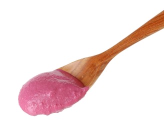 Photo of Tasty beetroot hummus in wooden spoon isolated on white