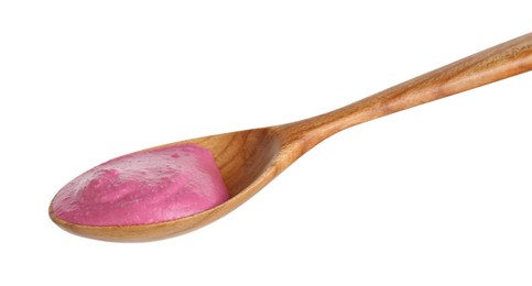 Photo of Tasty beetroot hummus in wooden spoon isolated on white