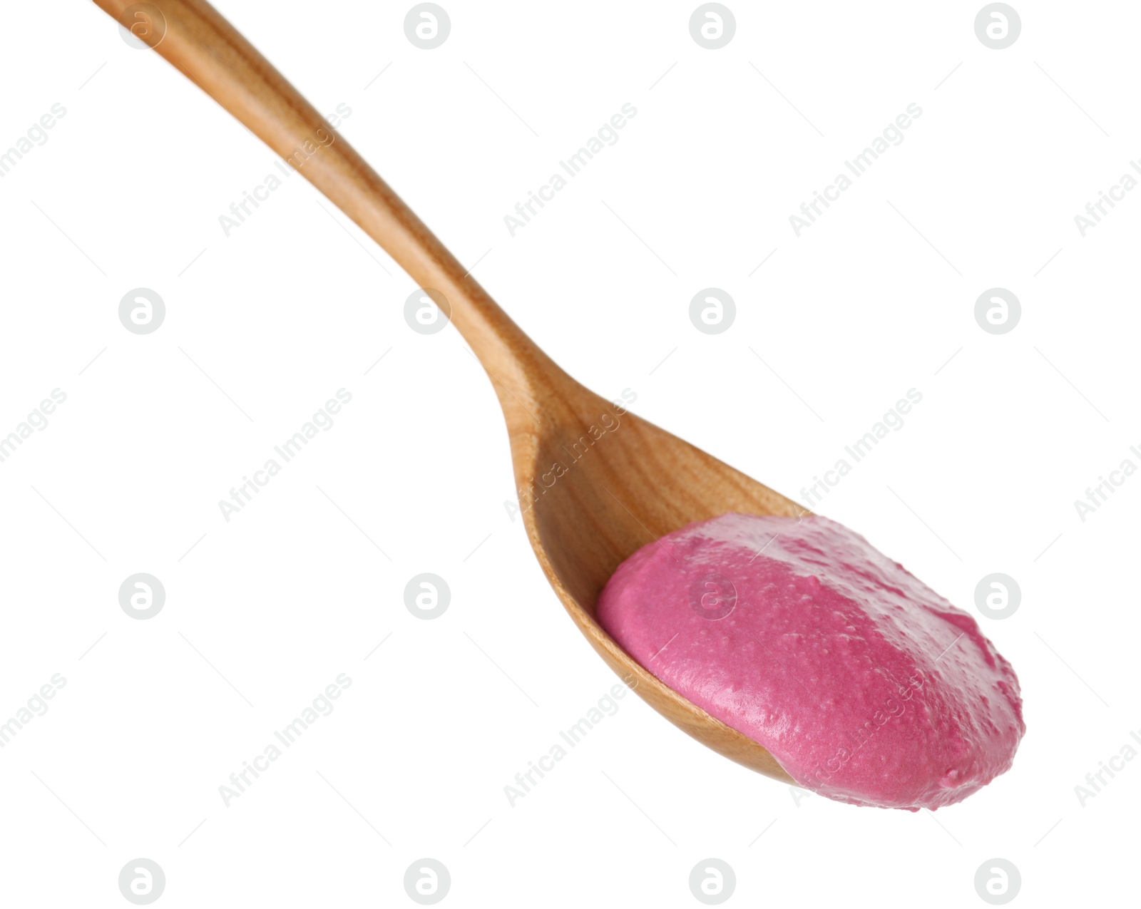 Photo of Tasty beetroot hummus in wooden spoon isolated on white