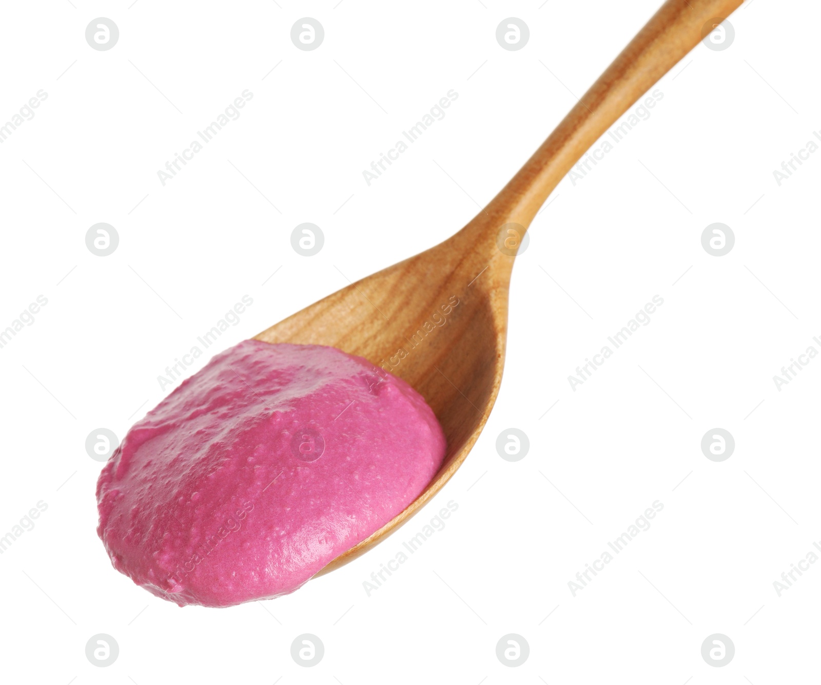 Photo of Tasty beetroot hummus in wooden spoon isolated on white