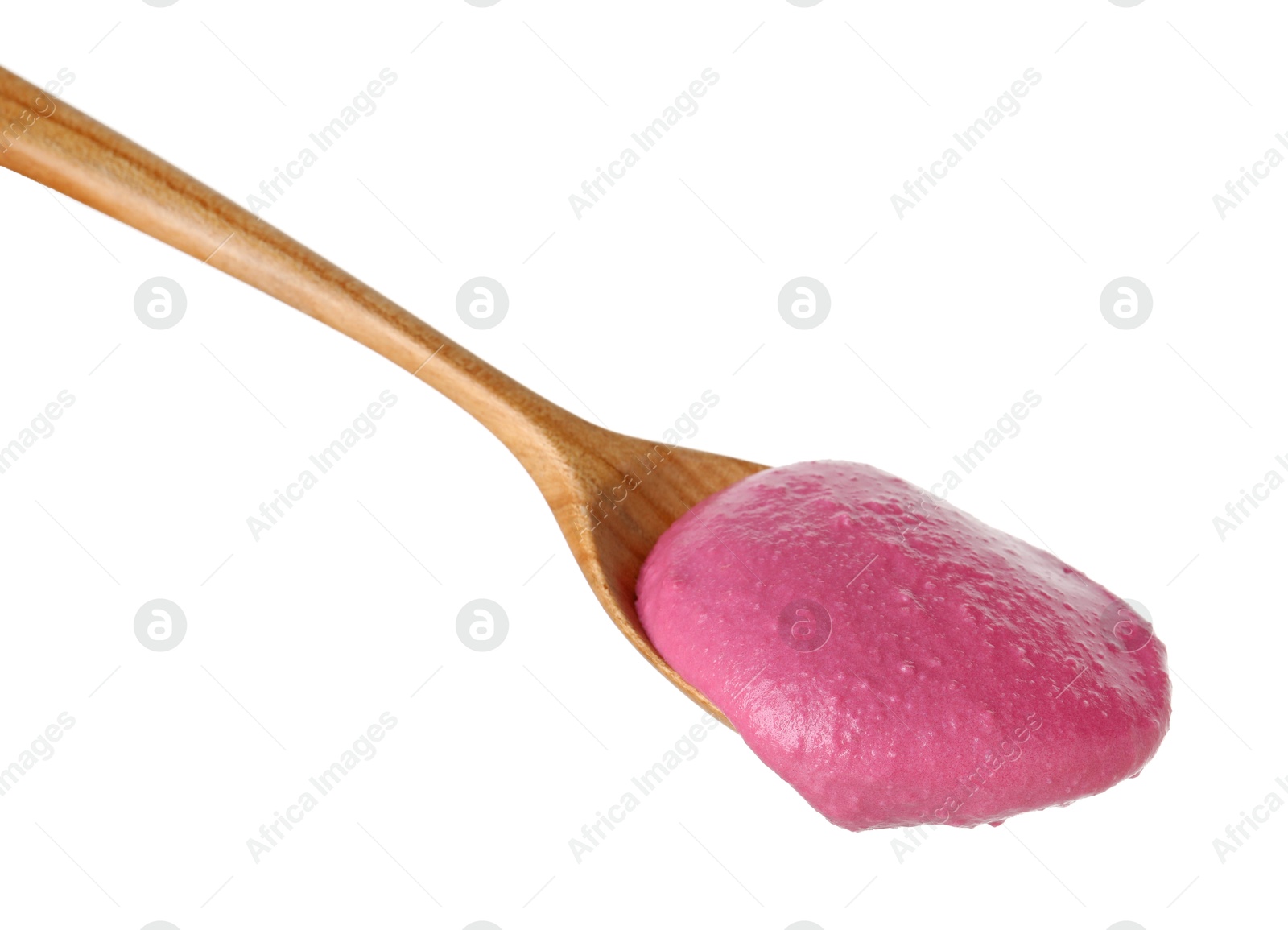 Photo of Tasty beetroot hummus in wooden spoon isolated on white