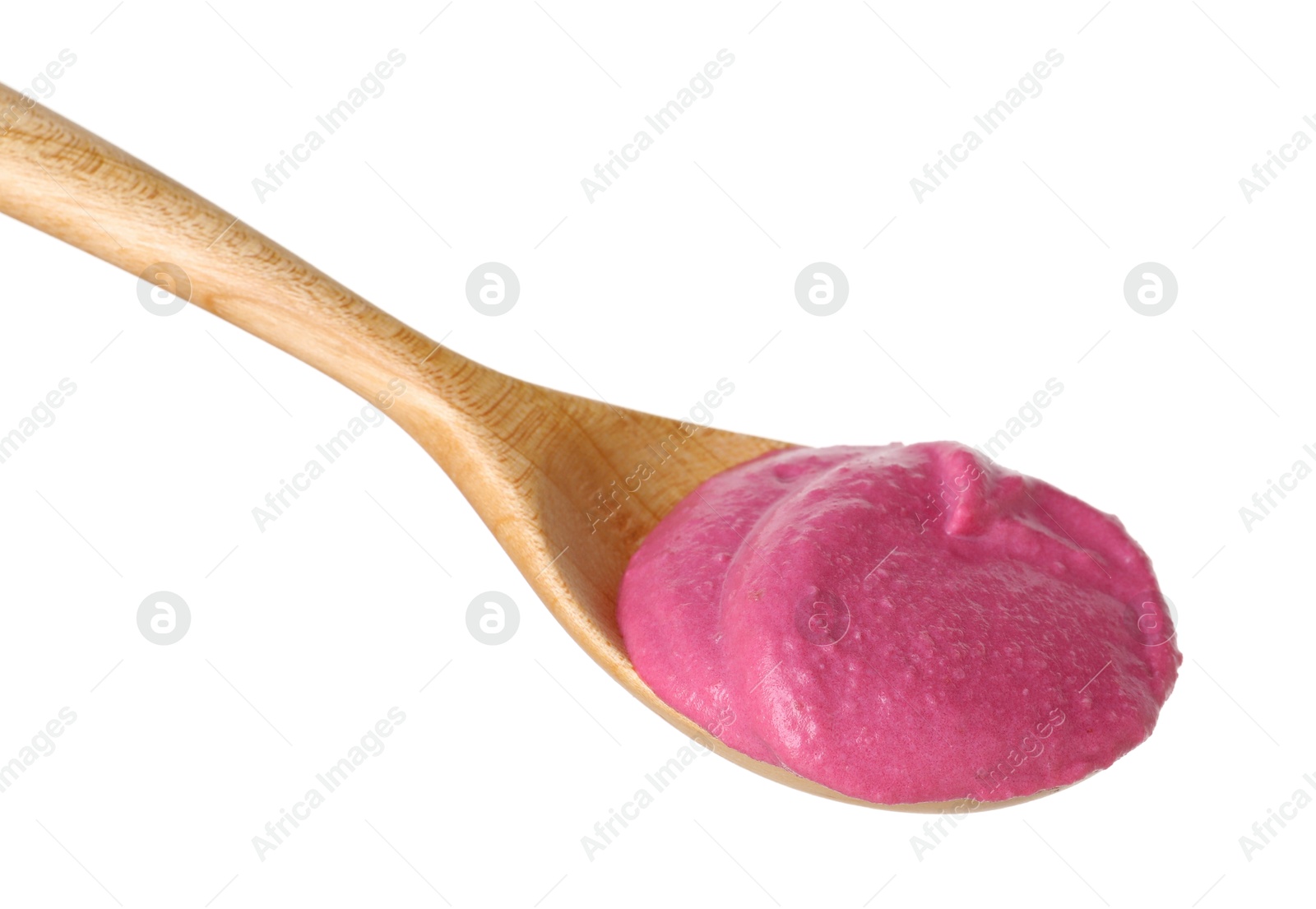 Photo of Tasty beetroot hummus in wooden spoon isolated on white