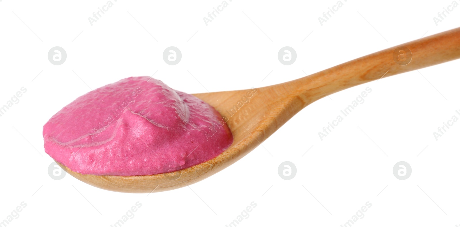 Photo of Tasty beetroot hummus in wooden spoon isolated on white