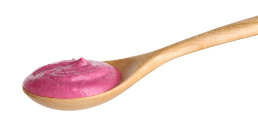 Photo of Tasty beetroot hummus in wooden spoon isolated on white